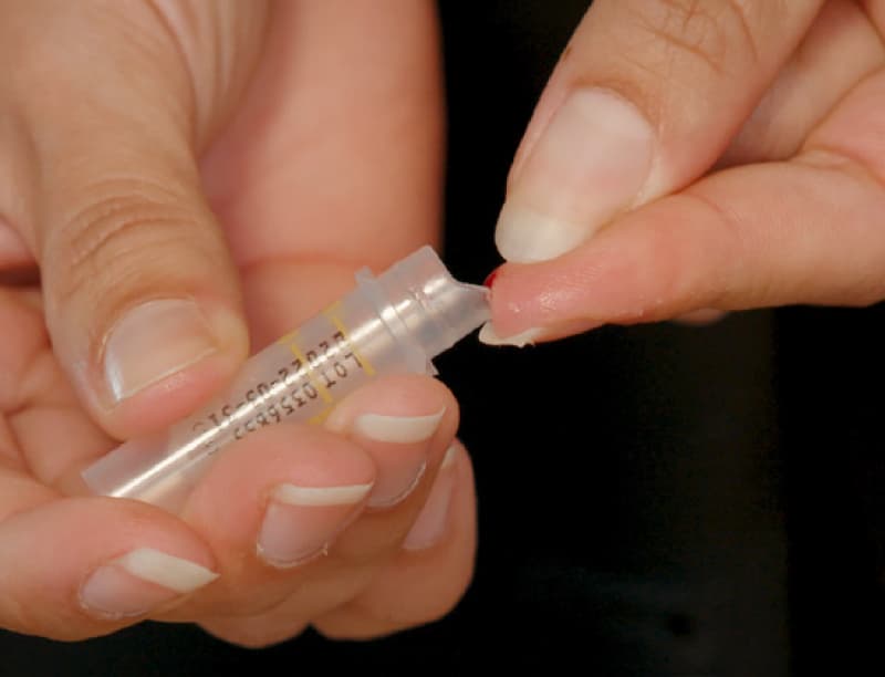 Collecting blood into tube